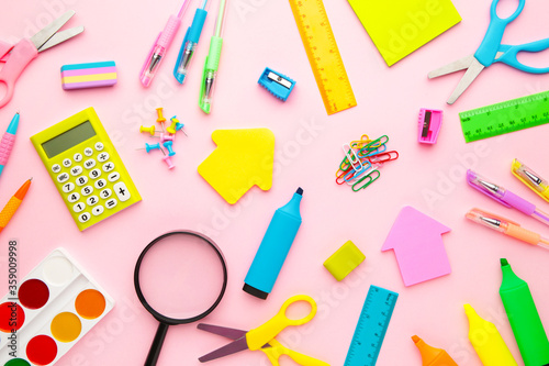 School supplies on pink background. Back to school. Flat lay. Minimalism