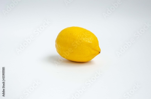 Yellow fresh lemon close up background
