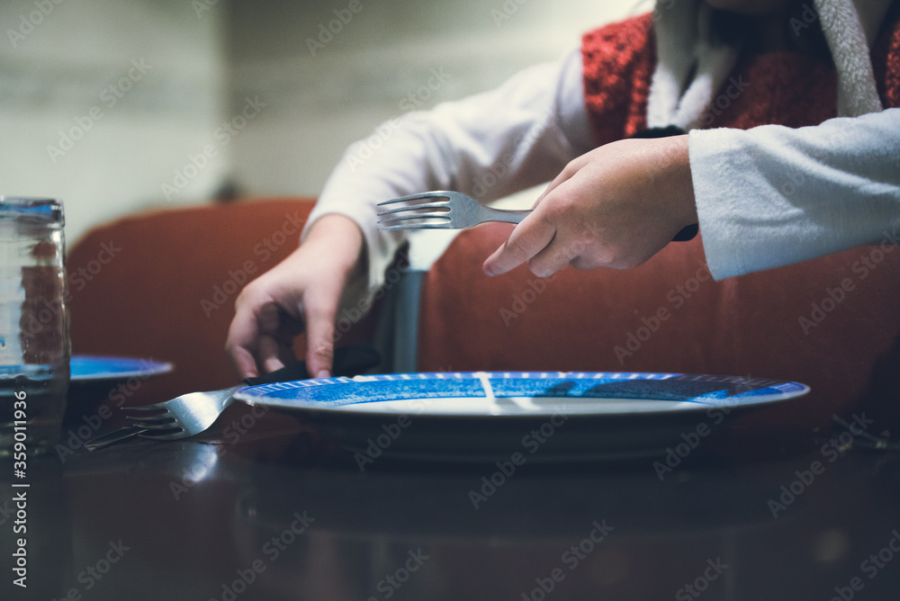 Everyone preparing the table to eat with the family in difficult times