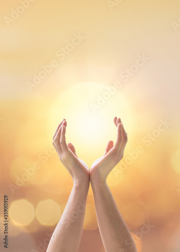 Mind and soul mantra yoga meditation, spiritual mental health practice with woman pose peaceful relaxation training with sunset golden hour summer june solstice sun and sky can candle light bokeh