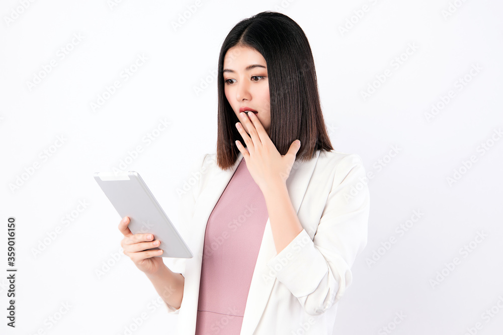 Working Woman looking at the tablet with surprise Working Woman looking at the tablet with surprise