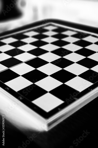 a chess board on a table, Selective focus, Selective focus on subject, background blur