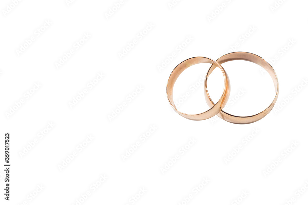 Two gold wedding rings isolated symbolize love, wedding Two gold wedding rings isolated symbolize love, wedding