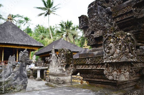 Ancient statue and carving in Hindu temple Pura Tirta Empul, Bali, Indonesia.