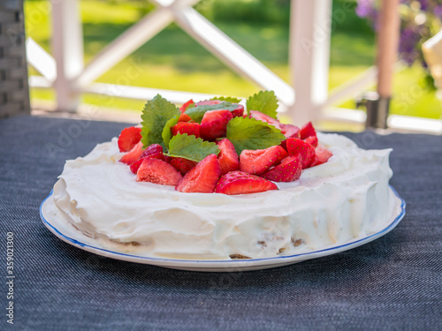 Home made strawberry cake with whipped cream. Typical Swedish dessert in midsummer.