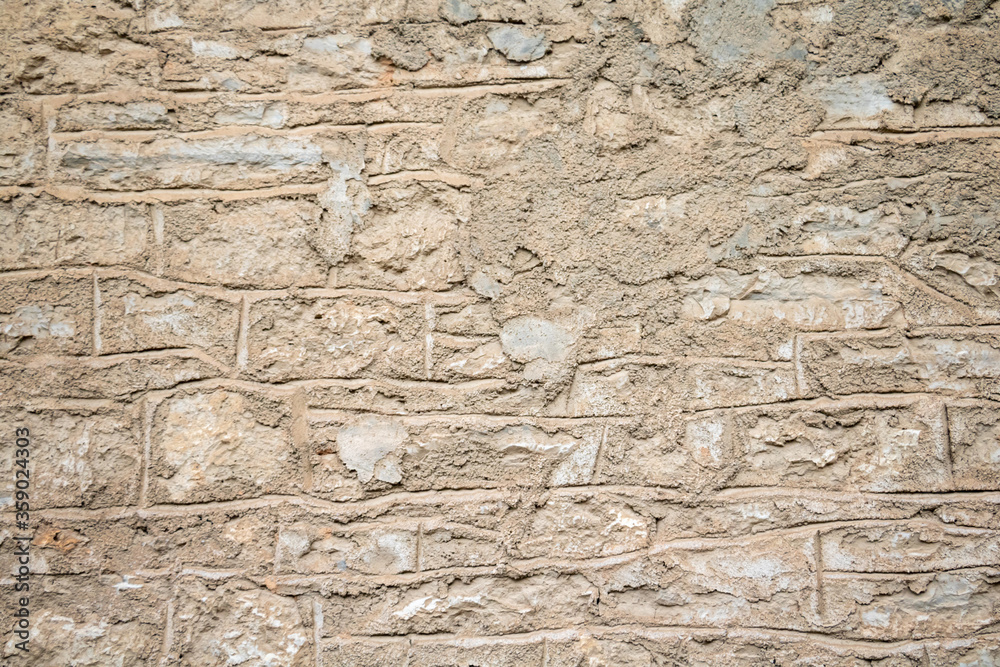 Grey beige color, stone wall background and texture