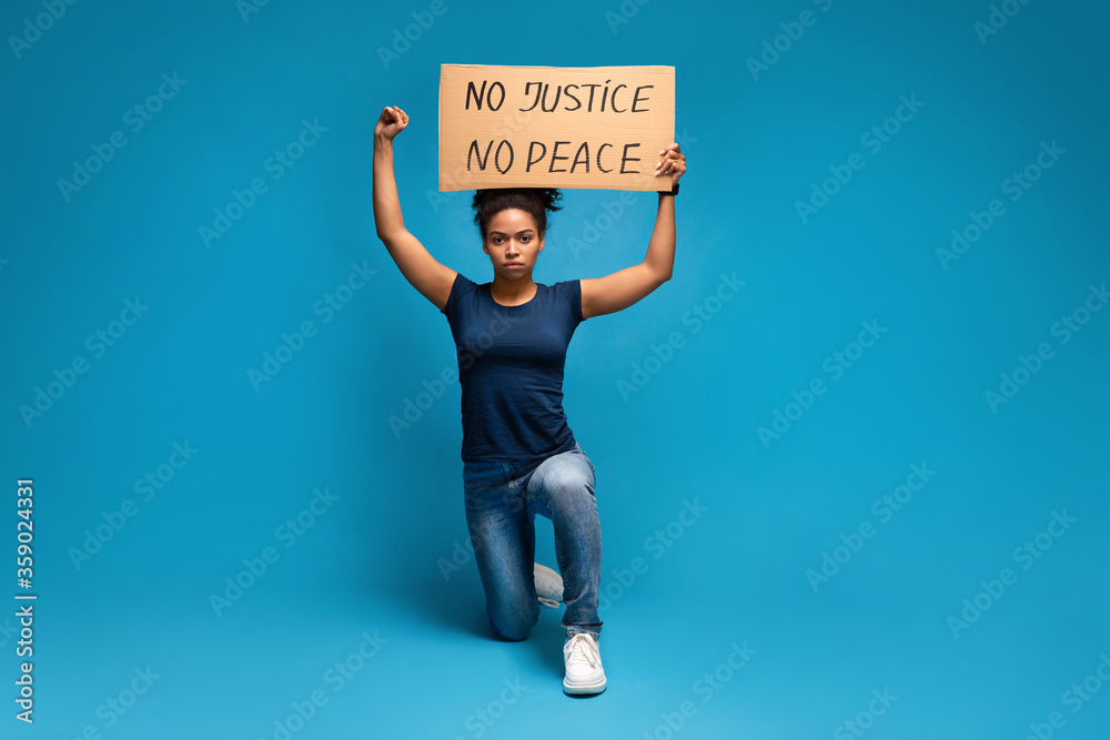 African american woman protesting with No Justice No Peace