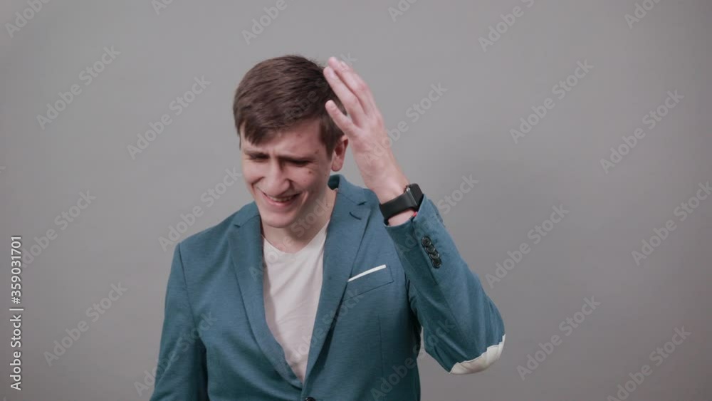Holding head with hand can not believe shocked and despair being in panic, having forgetful look. Frustrated nervous freaking out, worrying because messed up. Young attractive man, dressed jacket Holding head with hand can not believe shocked and despair being in panic, having forgetful look. Frustrated nervous freaking out, worrying because messed up. Young attractive man, dressed jacket