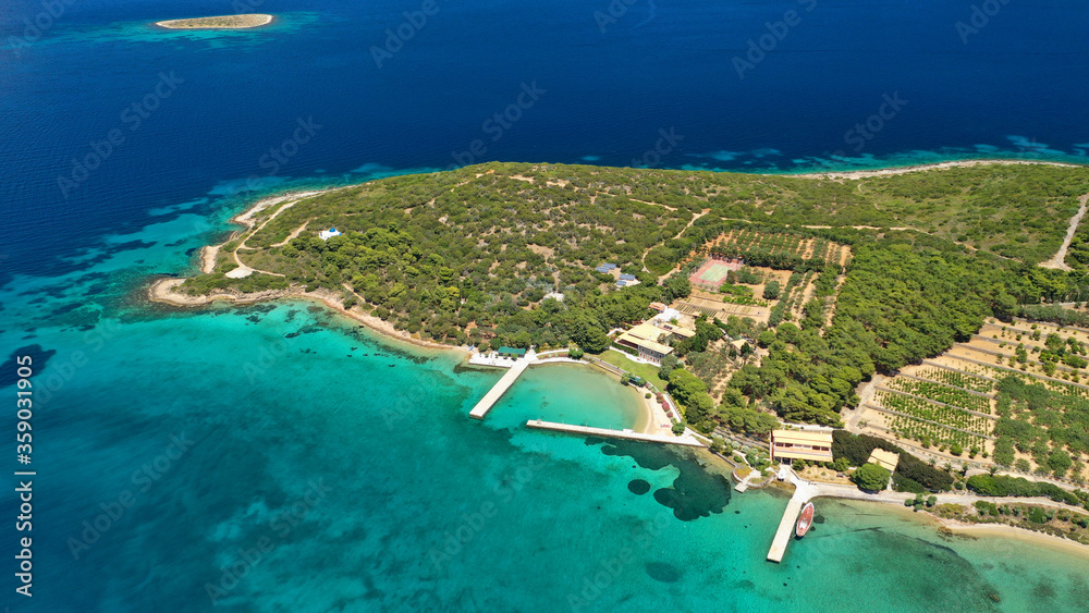 Aerial drone photo of beautiful paradise island of Tragonisi in gulf of of Petalioi or Petalion and island complex that forms a blue lagoon, South Evoia island near Marmari, Greece
