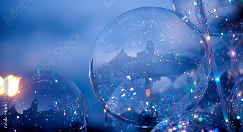 city reflection in Transparent inflatable balls close-up in evening