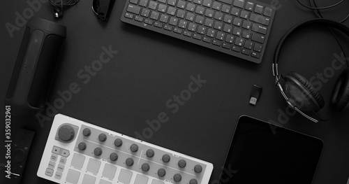 Audio producer concept. Various digital recording audio music gadgets placed on black background.