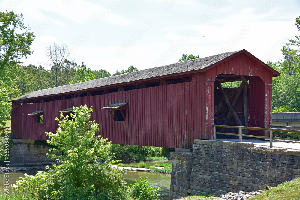 Covered bridge over a small creek Covered bridge over a small creek