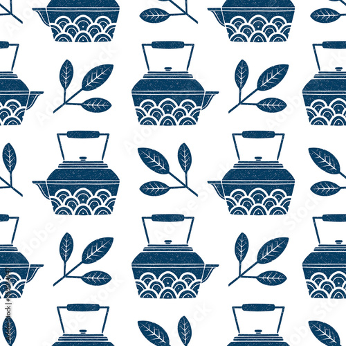 Simple seamless vector pattern with kettle teapot and tea leaves. Blue and white.