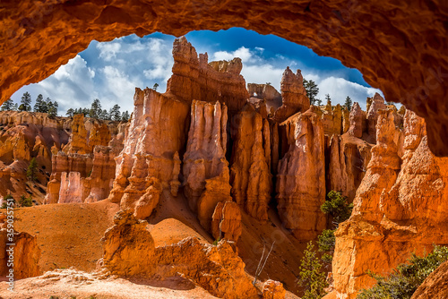 A view of hoodoos seen through a rock arch in Bryce Canyon, Utah in Springtime