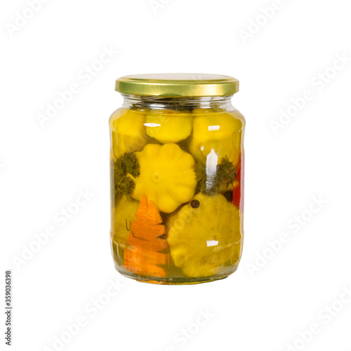 marinated scalloped squash in glass jar isolated on white
