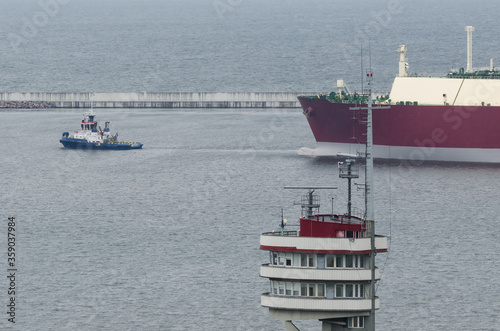LNG TANKER IN THE SEAPORT - The ship maneuvers in the gas terminal basin

