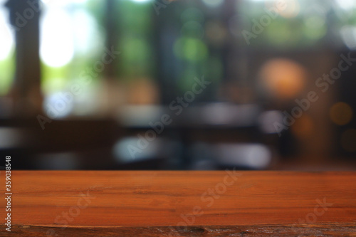 Empty wooden table in front of abstract blurred Cafe  restaurant  house interior. For montage product display or design key visual layout - Image