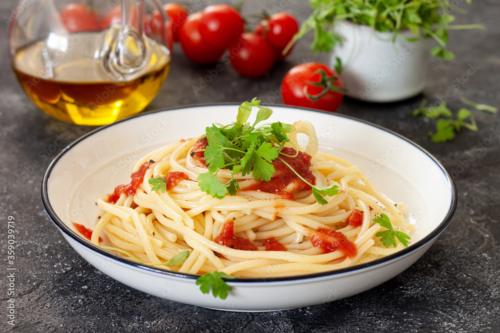 Spaghetti with tomato sauce and parsley sprouts Spaghetti with tomato sauce and parsley sprouts