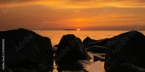 sunset on the beach and stones