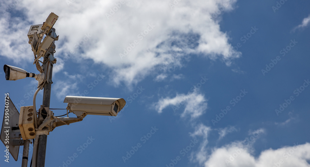 High resolution security camera, blue sky background, copy space.