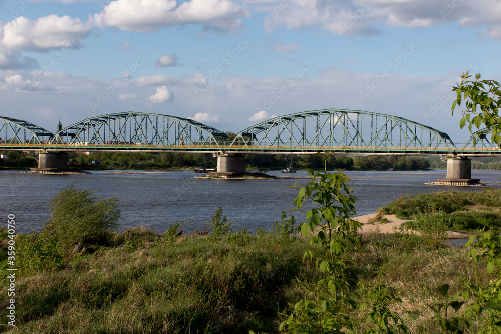 Fototapeta premium Fordon Bridge Rudolf Modrzejewski - a rail-road bridge, with a lattice structure, on the Vistula River in Bydgoszcz, in the Fordon district in Poland.
