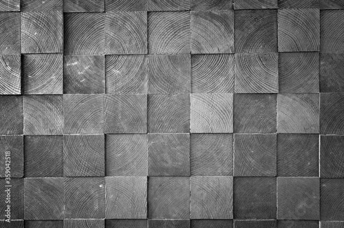 Close-up of stacked wooden boards and planks, view of the ends.