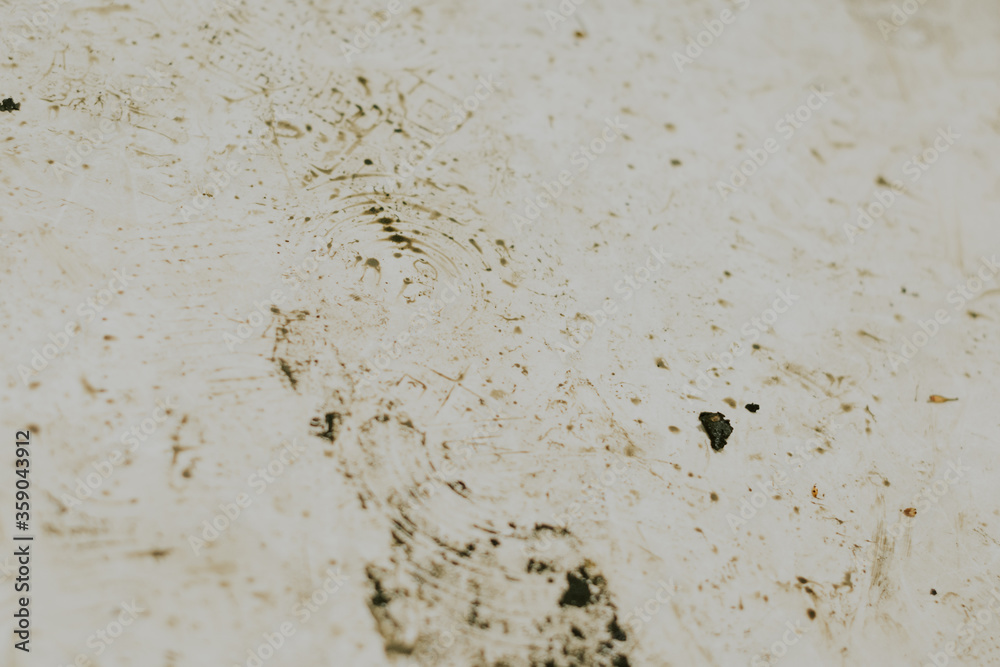 Black wet footprints over dirty tiles Black wet footprints over dirty tiles