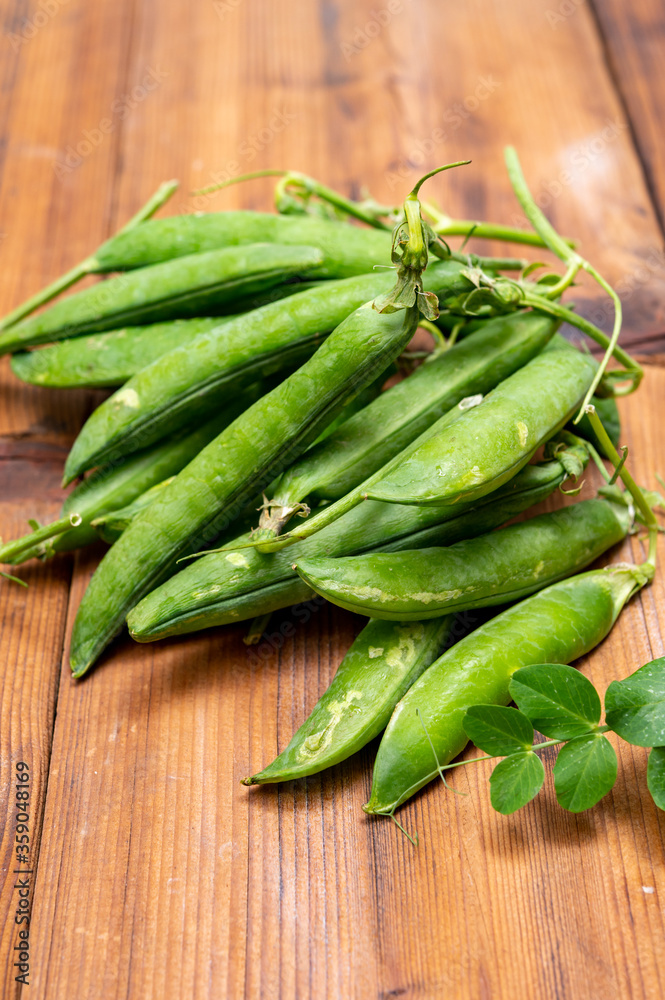 New harvest of ripe green peas legumes New harvest of ripe green peas legumes