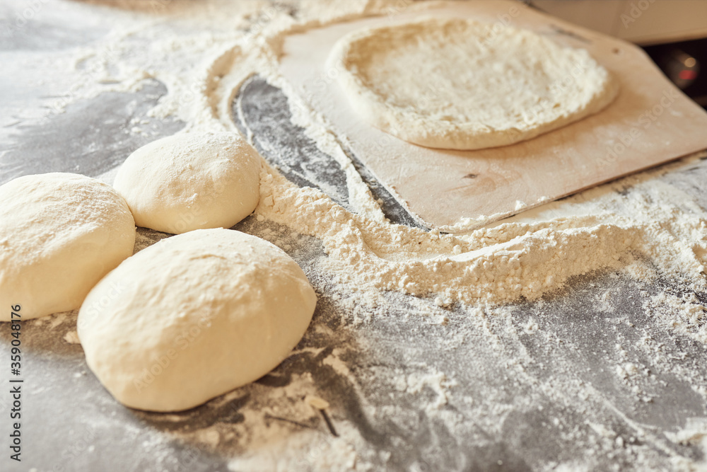 making a pizza, preparation of dough, clear and clean shot making a pizza, preparation of dough, clear and clean shot
