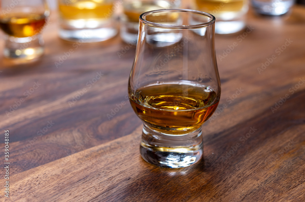 Scotch single malt or blended whisky tasting on distillery in Scotland, UK Scotch single malt or blended whisky tasting on distillery in Scotland, UK
