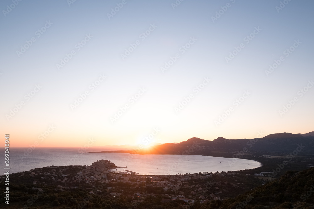 Sunrise over Calvi Bay and citadel in Corsica