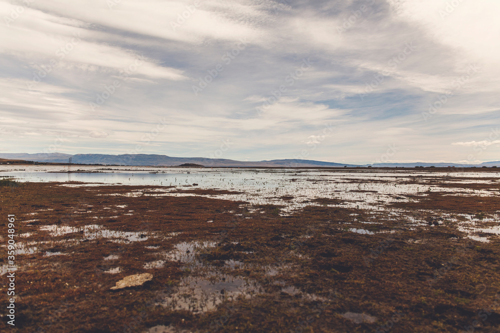 field lake sky and mountains