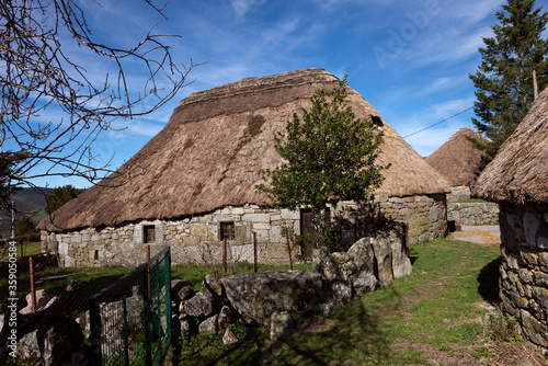 Palloza in Piornedo de Ancares (Galicia, Spain). Traditional village of Ancares mountain range in Lugo province, famous for its traditional buildings of pre-Roman culture with thatched roofs. photo