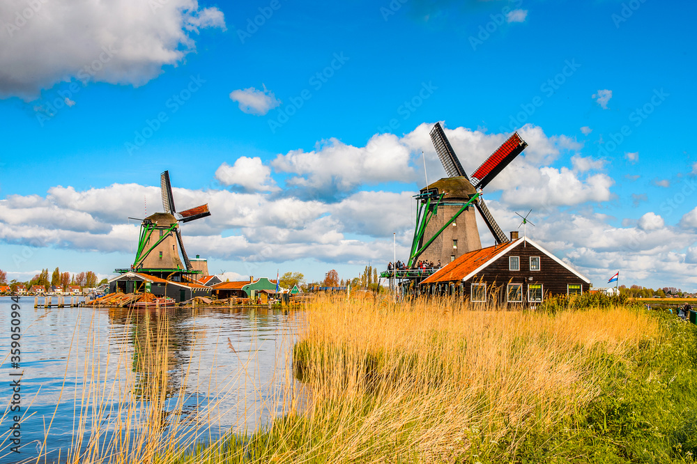Naklejka premium It's Windmill in Zaanse Schans, quiet village in Netherlands, province North Holland