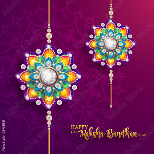 Decorated rakhi for Indian festival Raksha Bandhan Greeting Card ,indian festival with gold patterned and crystals on paper color Background.