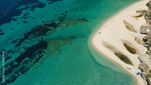 Aerial drone photo of beautiful secluded tropical exotic peninsula sandy bay and beach with emerald sea