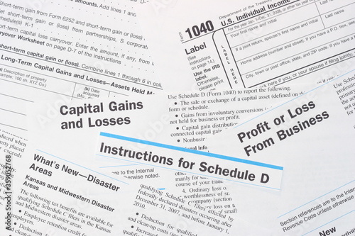 IRS Federal Income Tax Forms, Schedule D, 1040, Capital              Gains and Losses, Profit or Loss from Business, Disaster Collage  © PondShots