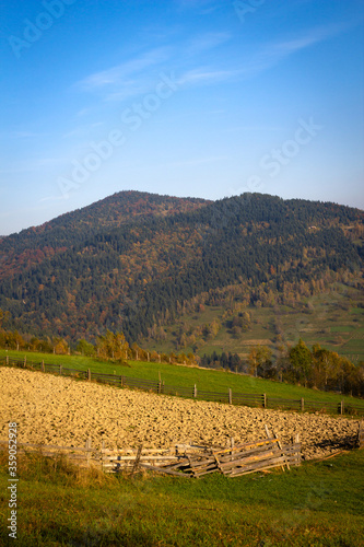 Plowed field and Parchowatka and Laziska Mountains near village Lomnica-Zdroj, Poland. Beskid Sadecki in Autumn.