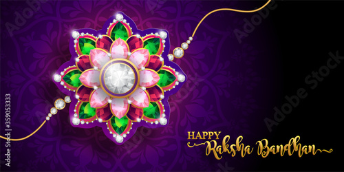 Decorated rakhi for Indian festival Raksha Bandhan Greeting Card ,indian festival with gold patterned and crystals on paper color Background.
