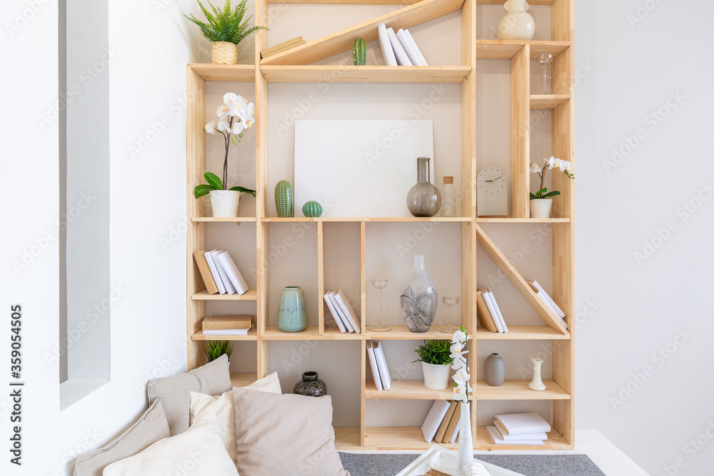 Fototapeta premium Luxury fashionable modern design studio apartment with a free layout in a minimal style. very bright huge spacious room with white walls and wooden elements. sitting area with fireplace