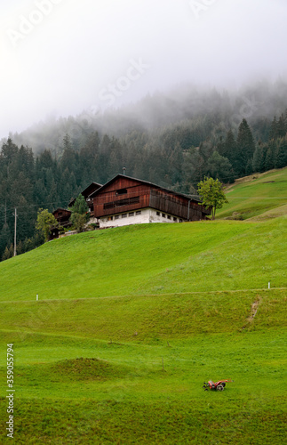 Mountain farmstead on a slope in the Lesachvalley of Austria photo