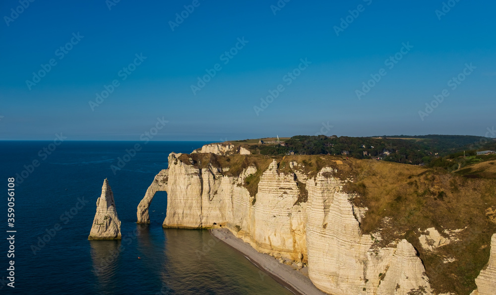 Pointed rock formation and arch on the coast of Etretat in France