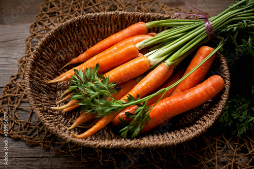 fresh ripe carrots in a basket