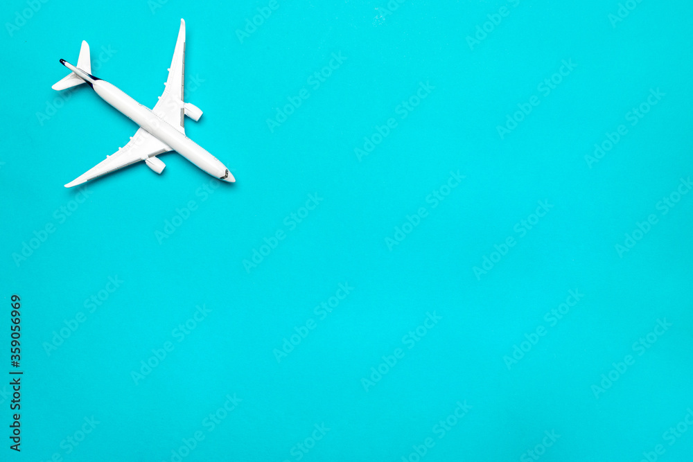 Toys kids aircraft backdrop. White toy airplane in close up view with copy space for flight air plane travel concept.
