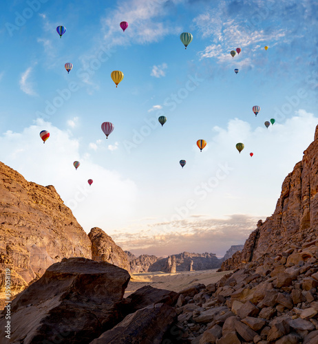 Outcrops at Mada'in Saleh archaeological site during the Tantora Balloon Festival, Al Ula, Saudi Arabia photo