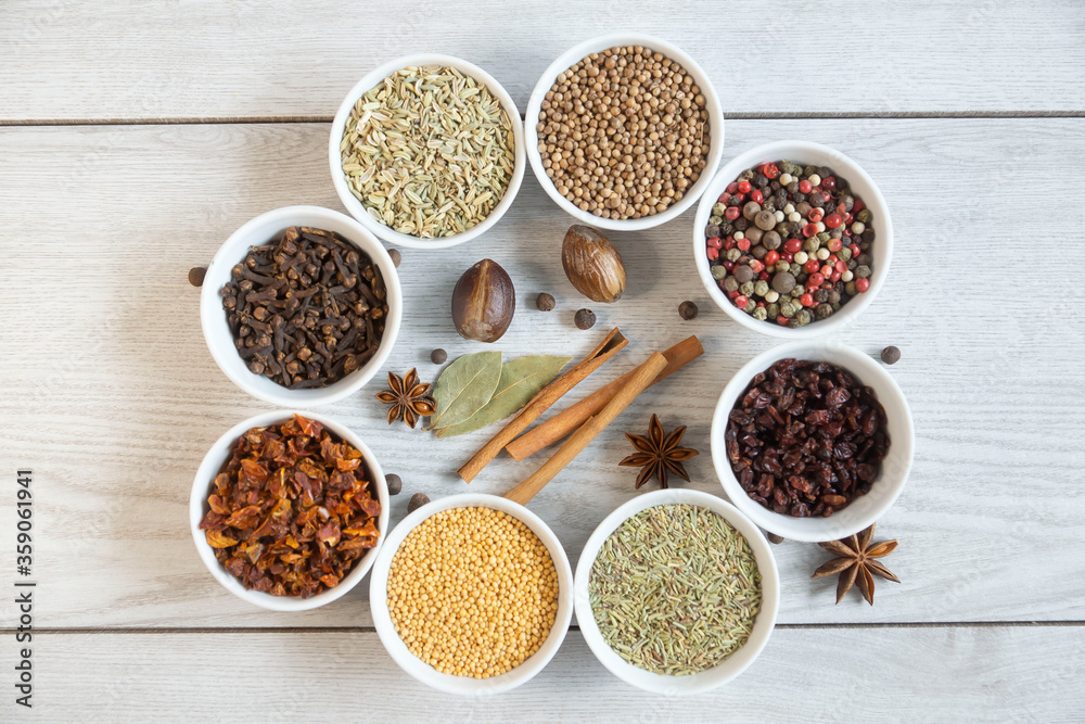 Dry seasonings and spices against a dark background view from the top.