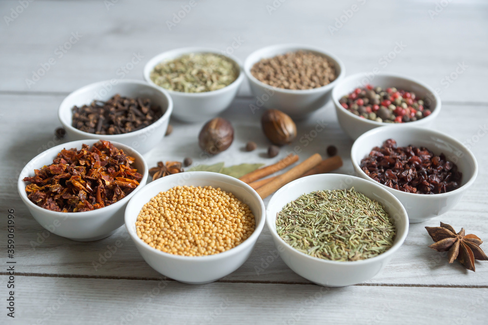 Dry seasonings and spices against a dark background view from the top. Dry seasonings and spices against a dark background view from the top.