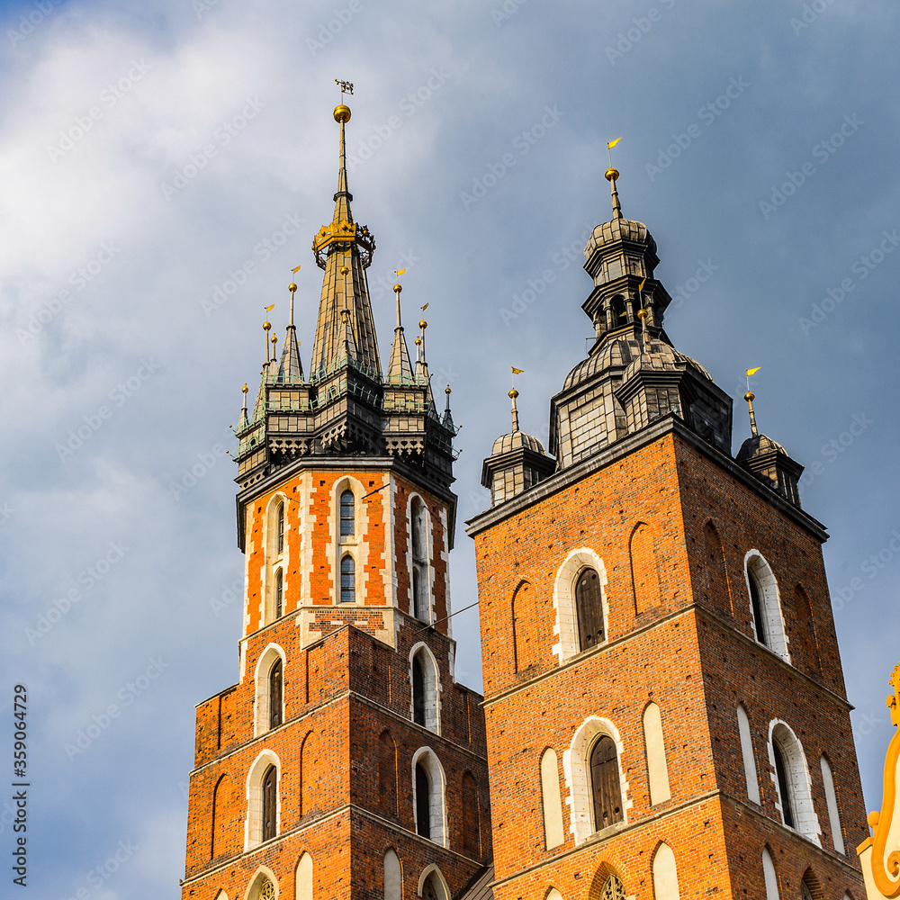 It's Saint Mary's Basilica at the Market square in the Old town of Krakow, Poland