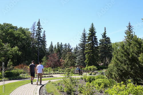 Winnipeg, Manitoba / Canada - June 13, 2020: Friends hiking at Assiniboine Park. photo