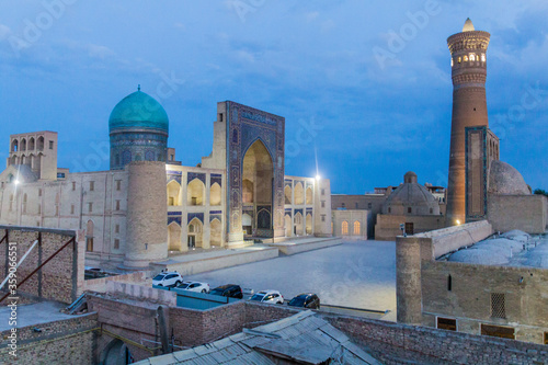 Evening view of Mir-i-Arab Madrasa and Kalan minaret and mosque in Bukhara, Uzbekistan